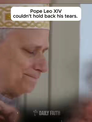 A close-up shot of a man's face, likely a religious figure, with tears streaming down his face. He is wearing a white and gold decorated hat, possibly a papal mitre. The background is a nondescript interior space, possibly a room or hall. The overall composition focuses on the man's emotional state and the solemnity of the moment.