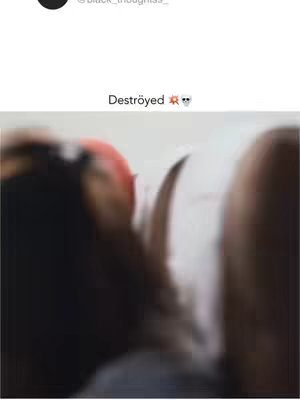 A slightly blurred image dominated by warm and dark colors of heads and shoulders. The focus is unclear, creating a sense of mystery or quick movement.