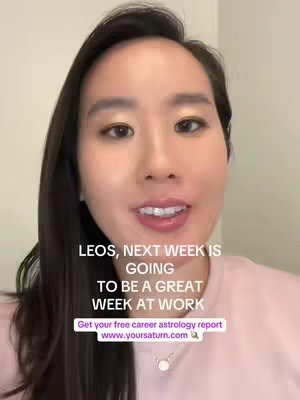 The cover image features a close-up of a woman with long dark hair and gold eyeshadow. She is smiling slightly and looking directly at the camera. Text overlays provide a message about astrology.