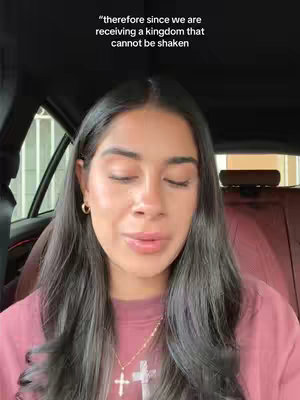 The cover image shows a woman sitting in a car, facing the camera. She has long, dark hair and is wearing a pink top and a gold necklace with a cross pendant. Text is overlaid at the top of the image. The background shows parts of the car's interior and a blurry view of the outside.