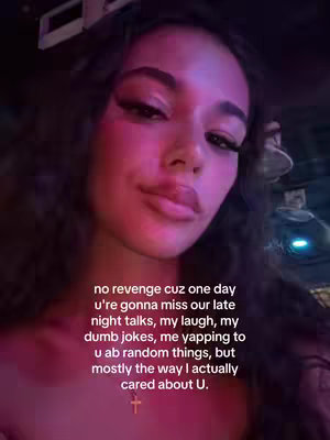 The cover image shows the upper body of a woman with a direct eye gaze. Her skin has a radiant, somewhat pinkish, tone, possibly influenced by lighting. The background appears blurred, suggesting a shallow depth of field.  Her makeup includes prominent eyelashes. There's text overlaid at the bottom.