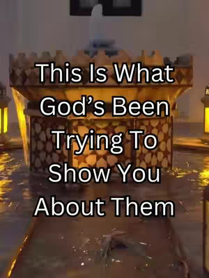 The cover image features a decorative structure with water flowing over it. The structure appears to be lit with warm, golden light, suggesting a nighttime or indoor setting. Text overlayed on the image reads, "This Is What God's Been Trying To Show You About Them." Water is cascading around a fountain-like structure within an illuminated setting.