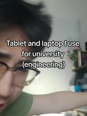 A selfie-style video cover image shows a young man with glasses, angled from the chest up, in a brightly lit room. The background is slightly blurred, but appears to be a domestic setting with a shelf and some decorations visible. The man's face is the focus, and he is looking directly at the camera, giving the impression of engagement and direct address to a viewer. Text overlayed in white font is at the top, providing context and immediate information.