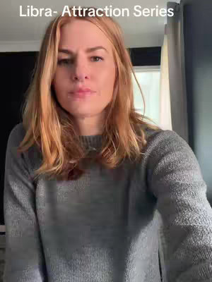 A woman with auburn hair and a grey sweater is looking at the camera. The text overlay says "Libra - Attraction Series" in white font at the top.