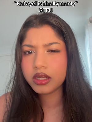 A close-up shot of a person with dark hair and fair skin. Text overlays the image. The person has dark lipstick and blush. They are looking at the camera with an expression that suggests skepticism.