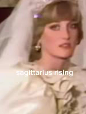 The image shows a blurred, vintage-style shot of a woman, likely a bride, wearing a veil, wedding dress, and a headpiece over her blonde hair. The text overlayed with the text 'sagittarius rising'.