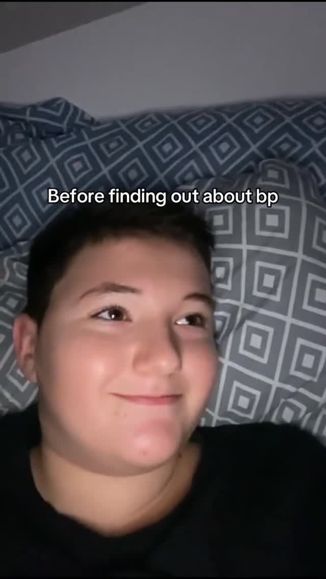 The cover image shows a person with short hair lying on a bed with a patterned pillow. The person is looking up at the camera and smiling. White text overlayed on the image says 'Before finding out about bp'.