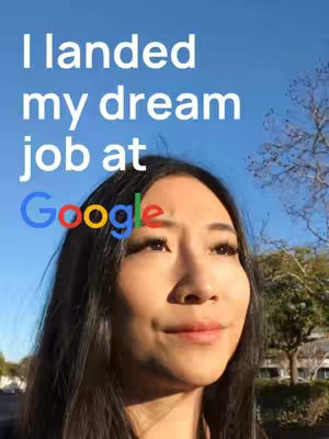 A young woman with long, dark hair smiles towards the right side against a bright blue sky, with text overlayed in white above her that says "I landed my dream job at Google." The Google logo is also present.