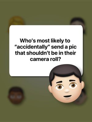 The image has a blurred olive-green background. In the center, a white rectangular speech bubble is displayed with rounded corners and a shadow effect. Clear text is centered within the bubble asking, "Who's most likely to 'accidentally' send a pic that shouldn't be in their camera roll?" At the bottom right of the bubble is a cartoon emoji of a man with short black hair, brown eyes, and a slight smile. There are indistinct emoji faces in the corners.