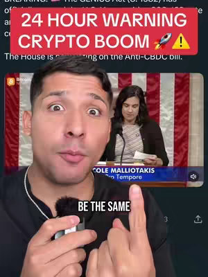 A man with a surprised expression points upwards, overlaid with a graphic that reads "24 HOUR WARNING CRYPTO BOOM". A smaller screen displays a woman speaking at a podium.