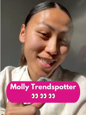 A close-up shot of a woman smiling with braces, a light background and a pink banner overlay with text.