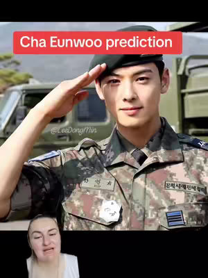 The cover image presents a split-screen. On the top half, it features a photo of Cha Eunwoo in an army uniform performing a salute with text overlayed that reads 'Cha Eunwoo prediction'. The bottom half displays a woman with a somewhat emotive facial expression.