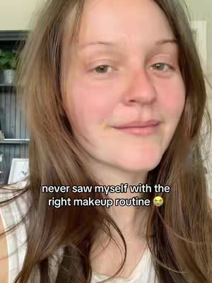 The cover image shows a woman in a close-up shot, with her brown hair framing her face. She looks toward the camera with a slight smile, with text overlayed at the bottom: 'never saw myself with the right makeup routine'. The background is blurred with a shelf visible.