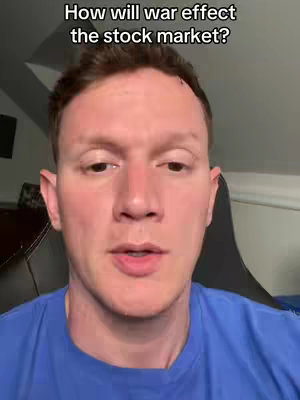A medium shot of a man's face, centered and looking towards the camera. He has short, light brown hair and fair skin. Above him, the text overlay states, "How will war effect the stock market?" He's wearing a blue shirt and the background suggests a home or office environment, with a neutral-colored wall and a glimpse of a dark chair.