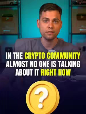 A man in a gray shirt is centered in the frame. Behind him, shelves hold various items, and the background suggests a studio set with framed items. Overlaid on the image is text in bold white and yellow positioned at the top is a coin in the bottom portion.
