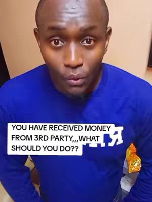 A man in a blue long-sleeved shirt is looking directly at the camera with a questioning expression. A white rectangle with black text overlayed on the image says, "YOU HAVE RECEIVED MONEY FROM 3RD PARTY,,,WHAT SHOULD YOU DO??" A small bag of chips is on the man's right chest area. The background is out of focus. 