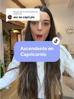 The cover image shows a young woman in a selfie-style video. She is looking towards the camera with an opened mouth expression. Overlay text in a blue rectangle reads "Ascendente en Capricornio". The background shows her home interior.