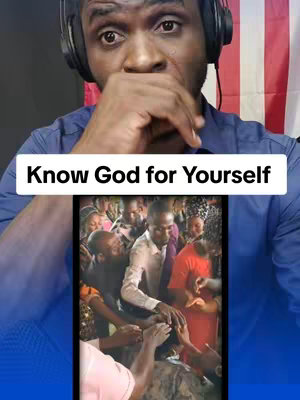 A man with headphones on, a blue shirt. He is holding his hand over his mouth in a reflective pose. Below, there is a second image inserted showing a crowd of people holding hands together.