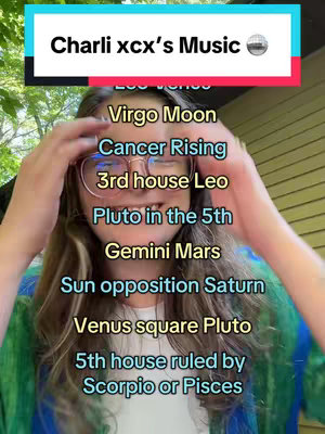 A selfie-style shot with a woman in the center, framed from the chest up. She's wearing glasses and appears to be looking towards the camera with a neutral expression. Overlayed text with various astrological terms is presented in a vertical list format, emphasizing the video's astrological theme. The background suggests a natural environment, possibly outdoors, creating a casual and informative setting.