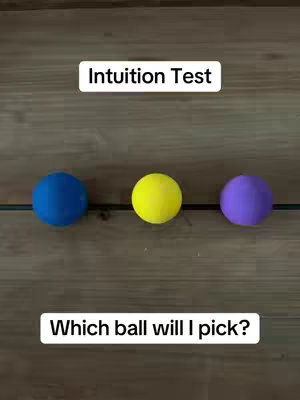 An image showing three colored balls, a blue, a yellow, and a purple, horizontally aligned. The top of the image has a text overlay saying 'Intuition Test'. The bottom of the image says 'Which ball will I pick?'