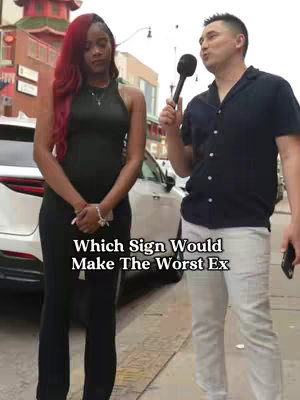 A man with a microphone interviews a woman on a city street. Text overlayed on the image asks "Which Sign Would Make The Worst Ex". The woman stands facing the camera, and the man is facing into her direction. They are standing in front of a car parked in the street.