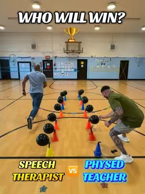 The cover image shows a gymnasium setting with two men preparing to participate in a physical challenge involving balloons and cones. The words "WHO WILL WIN?" are at the top, suggesting competition. The two men are positioned on either side of rows of cones with balloons.