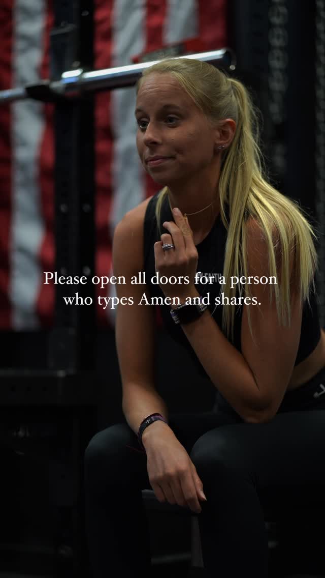 A young woman with blonde hair pulled back in a ponytail is sitting in a gym setting, looking slightly off-camera. The background includes gym equipment, a portion of an American flag, and text overlaid on the image.