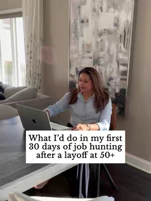 A woman with brown hair, dressed in a light blue collared shirt, sits at a wooden table with a laptop open. The background includes a large abstract painting, suggesting an indoor setting. The overlaid text states the video's topic.