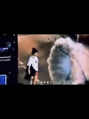 A short video clip shows a person, wearing a white shirt and black bottoms, walking on a street. Text overlays appear on the screen, partially obscuring the view. The background depicts a dimly lit urban environment, with a large, cloud-like structure on the right side of the frame.