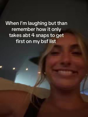 A selfie-style image featuring a young woman with blonde hair smiling. There's text overlayed on top which appears to be the video's hook. The background is blurred, suggesting an indoor setting.