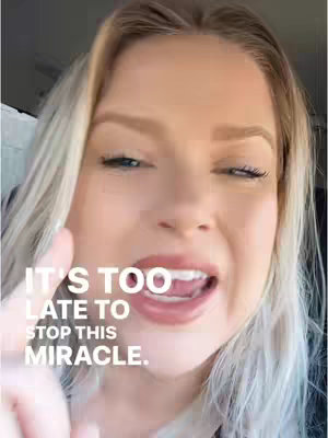A close-up shot of a woman with blonde hair and blue eyes looking towards the camera with a slightly open mouth and a finger pointing up. Text overlayed in white font reads: "IT'S TOO LATE TO STOP THIS MIRACLE."