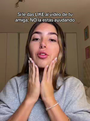 A woman with long hair is in front of the camera, with her hands touching her cheeks. Text is overlaid across the top.
