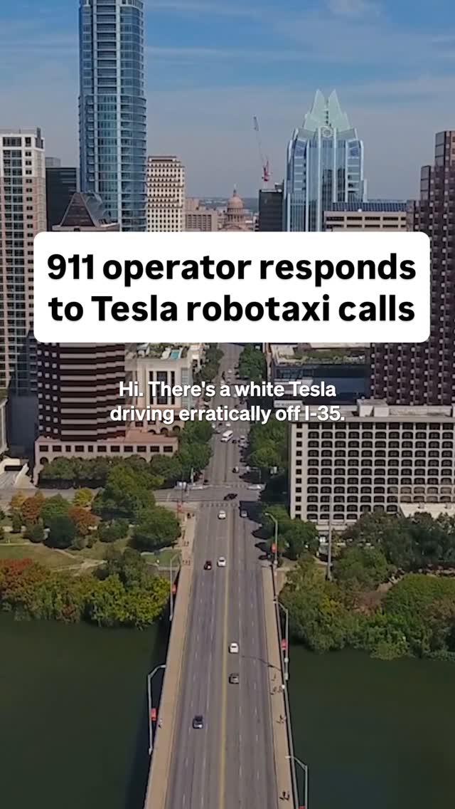 An elevated shot overlooking a bridge with several cars driving on it, with a river and buildings in the background. A text overlay at the top says '911 operator responds to Tesla robotaxi calls' with an additional text overlay saying: 'Hi. There's a white Tesla driving erratically off I-35.'