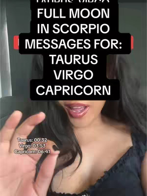 A selfie-style video cover features a woman with dark hair, parted on the side, and dark lipstick. The background appears to be inside a vehicle. The woman has one hand up near her face and a text overlay in black frames with white letters. The text says "FULL MOON IN SCORPIO MESSAGES FOR: TAURUS VIRGO CAPRICORN." In the bottom left corner, additional text states, "Taurus: 00:32 Virgo: 03:53 Capricorn: 06:41."