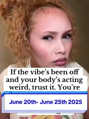 A close-up shot of a person with curly red hair and fair skin, possibly with makeup. The person has a somewhat serious expression and is looking towards the viewer. Text overlays are present, and a window-like frame at the bottom contains text. The overall composition suggests a selfie-style photo with a focus on the person's face.
