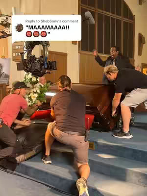 A behind-the-scenes look at a commercial shoot in a church, focusing on a scene involving a coffin and actors.