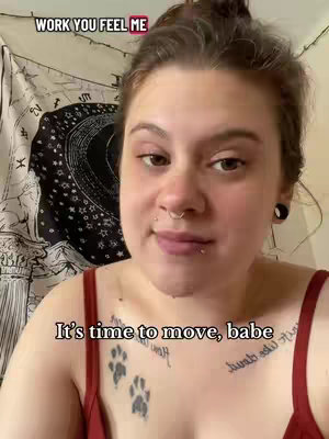 The cover image is a selfie-style shot featuring a person against a soft-focused tapestry. The person, centered in the frame, appears to be inside. The background shows the top of a tapestry with an intricate black and white circular design. The person has multiple piercings, visible tattoos, and a red top. White text is overlaid at the top, and additional text is added at the bottom.