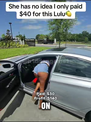 A woman wearing short jean-shorts bends into a silver car from the door, with a green grassy area behind the car. Text overlays include 'She has no idea I only paid $40 for this Lulu' and price figures.