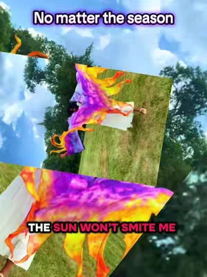 The cover image is a collage of several angled images and text overlays. The background appears to be a bright blue sky and a green grassy area. The main subject is a person waving several bright colorful flags, primarily yellow, red, and purple. The text overlays read "No matter the season" and "THE SUN WON’T SMITE ME".