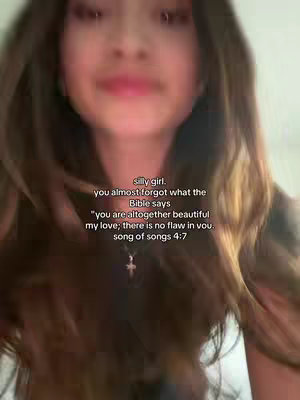 The cover image shows a blurred close-up of a person, likely a young woman, facing the camera. Her skin tone appears fair, and her long, wavy hair frames her face. The background is out of focus, with slight hints of light and color. Text overlays are placed over her upper chest and face, which could be to highlight her face and hair, giving softness and a gentle, intimate feel, with a subtle gold pendant necklace visible.