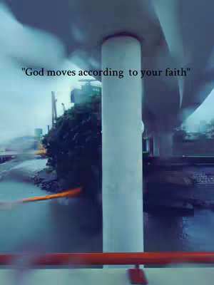 The image captures a wide, slightly angled view, possibly from a moving vehicle, showing an urban waterside scene under a cloudy sky. A large, white pillar stands prominently, with the blurred backdrop including trees, buildings, and infrastructure. The sky has a soft, diffused light. The image's colors are muted, giving it a sense of calm and slightly melancholic vibe. A reddish-orange line is at the front of the image.