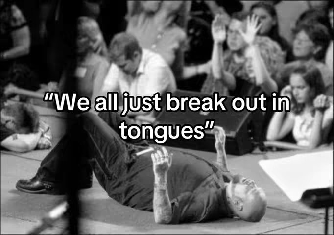 A black and white image featuring a chaotic church scene. In the foreground, a man lies on the floor, seemingly overcome. The background is a blur of people with hands raised, and focused on the crowd