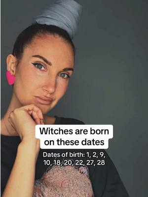 A selfie of a woman with fair skin and light eyes, wearing a grey head wrap and large pink heart-shaped earrings.  Text overlayed with the phrase 'Witches are born on these dates' and a list of birthdates below.