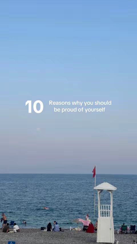 The cover image shows a beach scene. The top portion of the image is a clear, light blue sky. Below the sky, there is a body of water with a gradient, transitioning from a deeper blue at the top to a lighter shade closer to the horizon. On the beach, there are people, a lifeguard station, and a red flag.