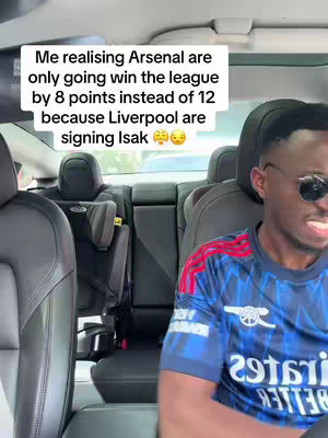 The cover image shows a selfie taken from inside a car. The driver, a Black man wearing sunglasses and a blue and red Arsenal jersey, is looking at the camera with a somewhat exasperated expression. The background includes car seats and a glimpse of the outside view.