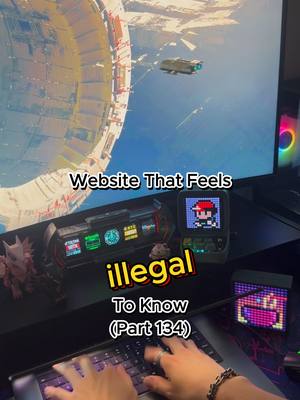 The image features a person's hands typing on a backlit keyboard. The desk setup includes a monitor displaying what appears to be a space scene or digital art, with a spaceship. Beside the monitor are various electronic devices, including a small pixel art screen. Text overlayed on the image reads 'Website That Feels Illegal To Know (Part 134)'.
