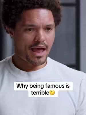 A medium shot of Trevor Noah with a surprised expression. The hook overlays at the bottom of the screen and reads: Why being famous is terrible.