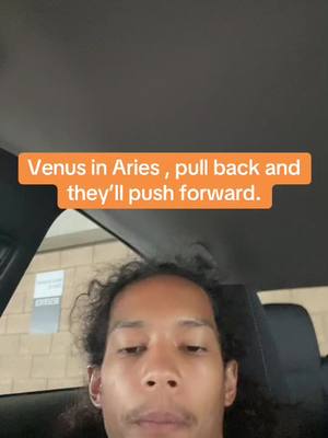 A selfie taken from inside a vehicle. The primary focus is on a person's face, with the background showing the car's interior and a glimpse of the outside. An orange rectangular text overlay is positioned above the person's head.