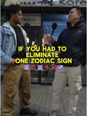 Two men are standing on a city street, facing each other with a building in the background. Text overlayed on the image directs the viewer to consider which zodiac sign to eliminate. The man on the right is holding a microphone.