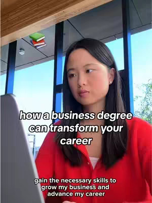 A young woman is looking at the camera and is featured with text and some green books in the background. There is also a laptop in the shot, as well as windows, and a bright sunlight. The woman is wearing a red shirt. Two lines of text are over the woman's head. Below the text is a third line.